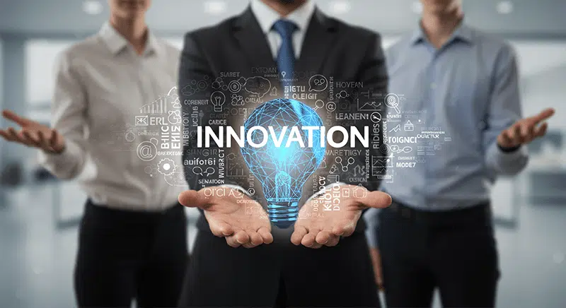 Business team holding digital innovation hologram representing integrated marketing and technology