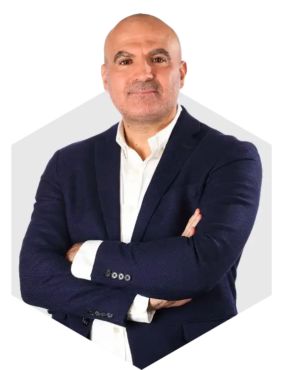 CEO of KIRA Marketing Management in a professional business portrait, arms crossed, wearing a dark suit